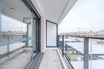 Urban terrace converted into a winter garden with a dark gray aluminum enclosure