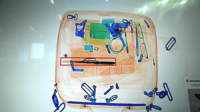 Modern Security System in Airport: Luggage X-Ray Scan of Passengers Bag shown on a screen. 