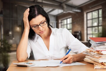 Young business woman working in office, feel stressed