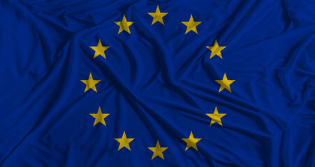EU flag with fabric texture background. National flag of European Union with cloth texture