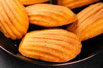 Madeleine cookies sweet dessert traditional french sweets tasty snack fresh delicious gourmet food background on the table rustic top view copy space