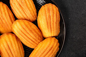 Madeleine cookies sweet dessert traditional french sweets tasty snack fresh delicious gourmet food background on the table rustic top view copy space