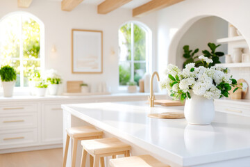 A bright and airy kitchen with a large island stools and a large blank frame on the wall providing a neutral and inviting backdrop for decor