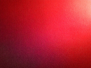 Close-up of vibrant red textured surface illuminated by soft natural lighting creating a warm gradient effect perfect for bold graphic backgrounds or design projects