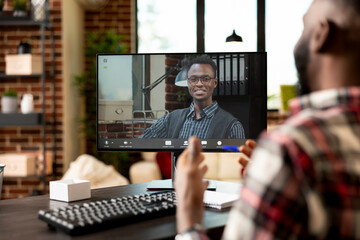 Businessmen having virtual discussion on commencing startup projects. Remote employee speaks with...