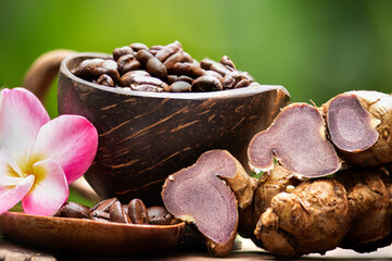 Black ginger is mixed with coffee and drunk for health on natural background.