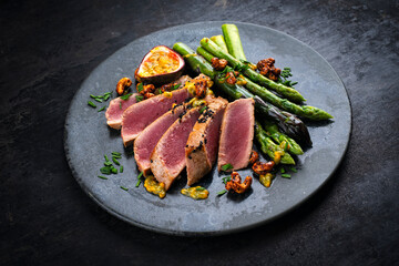 Tuna tataki steak with caramelized green asparagus, roasted cashew and  maracuja passion fruit...