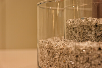 Round glass vessels filled with decorative shards and pieces