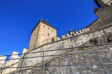 Historic stone castle tower with blue sky backdrop