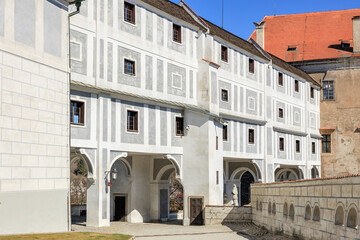 Obraz premium Historic castle courtyard with arched passageways and stone walls