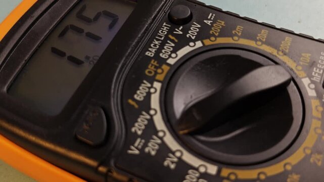 Digital Multimeter Displaying Fluctuating Voltage Readings in CloseUp.