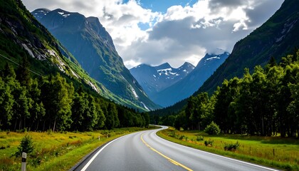 Fototapeta premium Winding road through a lush mountain valley