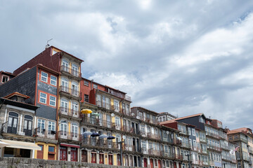 Colorful old houses with iron balconies in a historic riverside district Ribeira in Porto,...