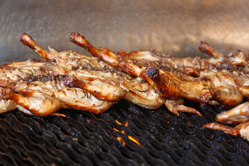 few flat chickens cooking on the grill, healthy eating, preparing lunch