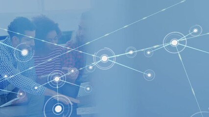 Colleagues leaning and pointing at chart initiating network nodes overlay during business session - Powered by Adobe