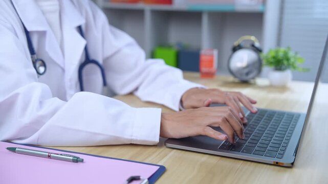 Medical staff with virtual digital calendar on laptop to plan patient treatment and follow up in hospital.