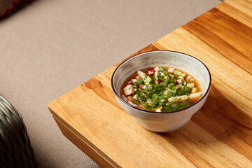 A Delicious Bowl of Fresh and Colorful Vegetables Drenched in a Savory Sauce for Enjoyment