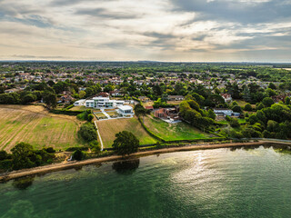Fototapeta premium River Hamble over Warsash Maritime Academy Pier from drone, Hamble-le-Rice, Warsash, Southampton Water, Hampshire, England