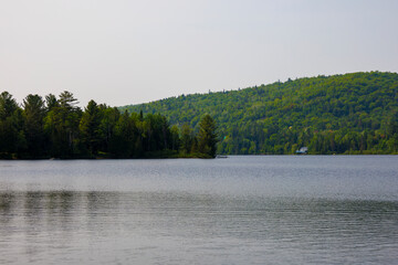 a beautiful view of a lake among the mountains on a summer day