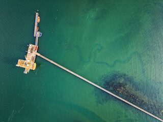 Top Down over Warsash Maritime Academy Pier and River Hamble from drone, Hamble-le-Rice, Warsash, Southampton Water, Hampshire, England