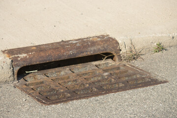 old rusty metal storm drain