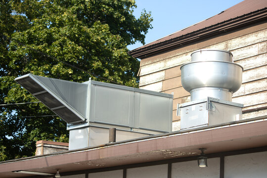 Commercial kitchen ventilation fans and ducting on the roof