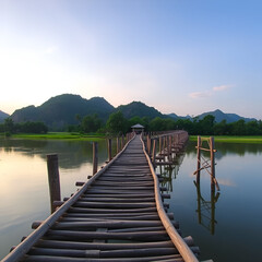 Fototapeta premium Auttamanusorn Wooden Bridge (Sapan Mon), Sungkaburi, Kanchanaburi, Thailand. Sangklaburi Sapan mon is most longer number two for wooden bridge in the world record.