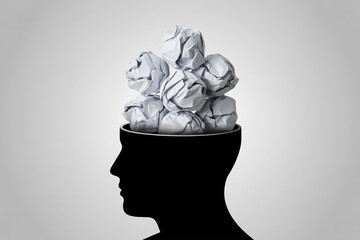 Mental clutter brain overload stress anxiety concept with crumpled paper inside head silhouette image