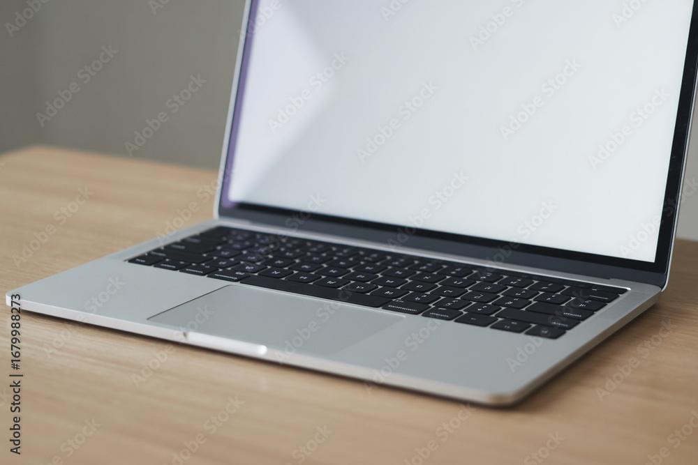 Poster laptop computer on desk for work from home or office setup and business technology concept for digit