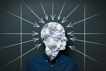 Stress overload concept with head filled with crumpled paper and arrows pointing inward showing pressure