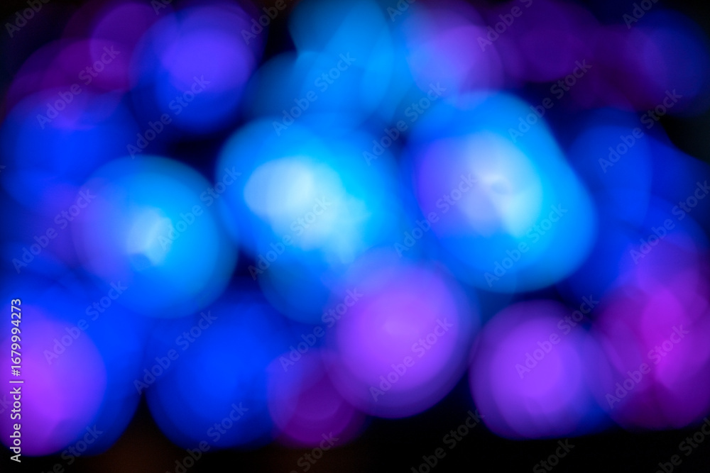 Poster a colorful abstract background featuring blurred light bokeh circles against a dark or black backgro
