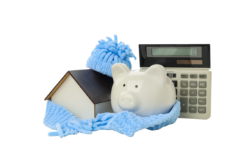 Winter savings: piggy bank and calculator, isolated on white, PNG