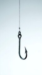 Giant Fishing Hook Dangling from Line on Plain Background