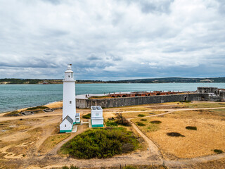 Hurst Point Lighthouse and Hurst Castle from drone over Hurst Spit, Milford on Sea, Lymington, Hampshire, England	