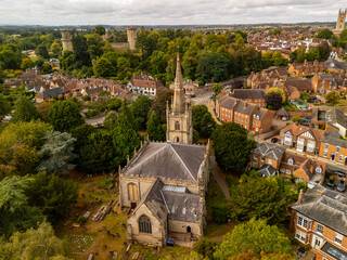 Aerial view of Warwick Castle and church dominating Warwick town in England