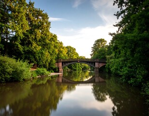 Naklejka premium Tranquil river bridge at dusk