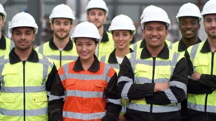 Diverse construction team smiling proudly together