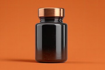 Dark glossy bottle with copper lid on orange background
