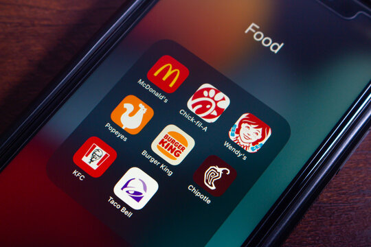 Mexico City, MEXICO - Aug 26 2025 : Mobile phone screen displaying a folder titled "Food" containing various fast food apps including McDonald's, Chick-fil-A, and Wendy&rsquo;s.