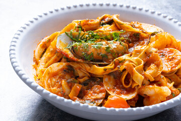 italian seafood pasta in tomato sauce