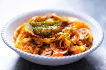 italian seafood pasta in tomato sauce