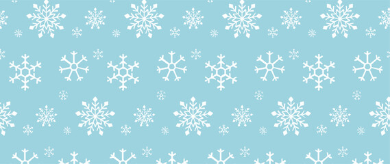 Winter-themed seamless pattern with snowflakes on a light blue background. Perfect for Christmas, New Year, textile, gift wrapping, and digital backgrounds.