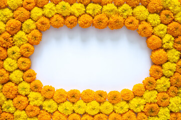 Decorative yellow and orange color marigold flowers rangoli for Diwali festival with white space...