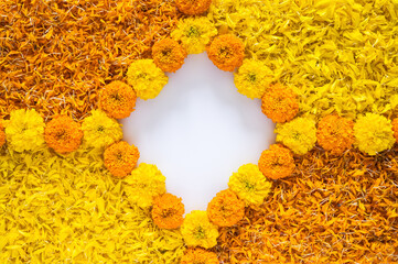 Diwali festival background with yellow and orange color marigold flowers and petals rangoli  with...
