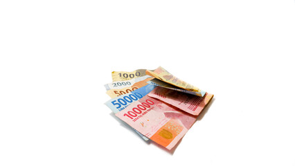 Indonesian Rupiah Banknotes in Various Denominations on White Background