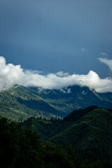 Naklejka premium clouds over the mountains