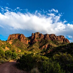Majestic Red Rock Mountains Under a Dramatic Cloudy Sky.