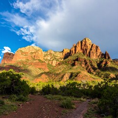 Majestic Sedona Red Rock Mountains Under Dramatic Cloudy Sky.