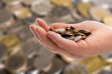Person hand giving coins money to homeless people