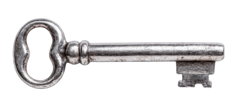 Antique, metallic key with a  decorative, ornate shape